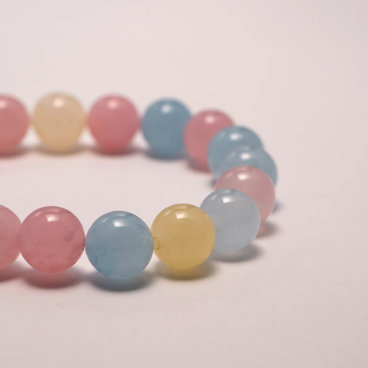 Tourmaline crystal bracelet featuring pink, yellow, and blue stones for emotional balance and joyful energy.