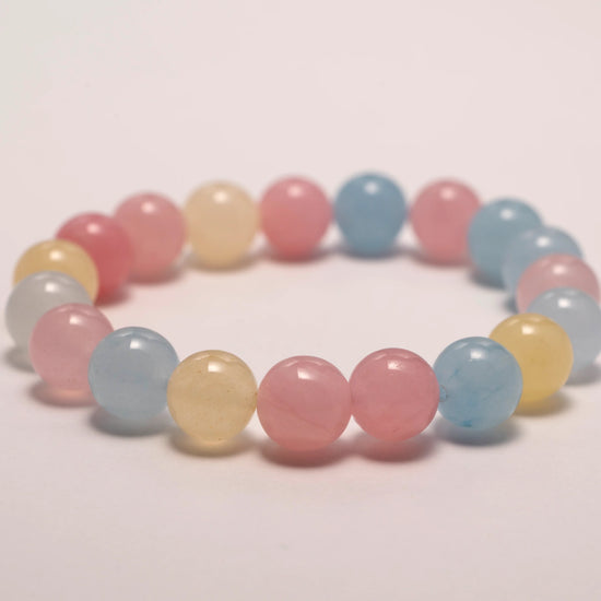 Tourmaline crystal bracelet featuring pink, yellow, and blue stones for emotional balance and joyful energy.