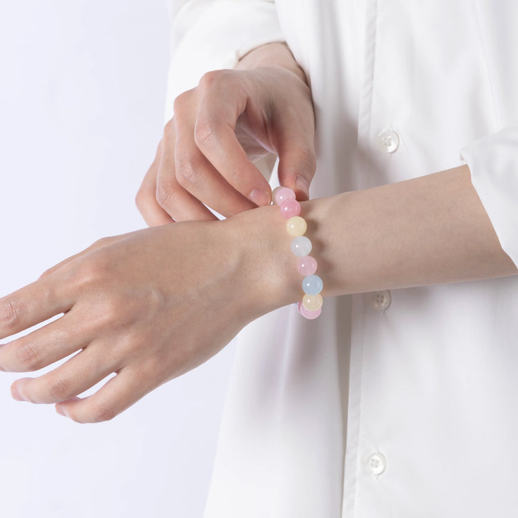 Tourmaline crystal bracelet featuring pink, yellow, and blue stones for emotional balance and joyful energy.