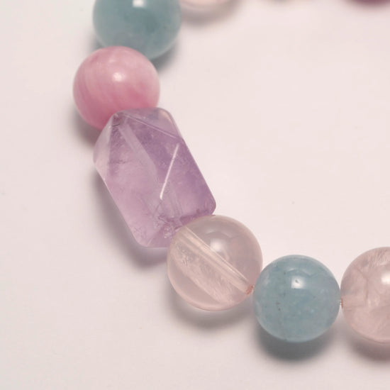 Lepidolite Crystal & Purple Rutilated Quartz Bracelet featuring Lepidolite, Aquamarine, Purple Rutilated Quartz, and faceted Lavender Amethyst for emotional clarity and inner peace