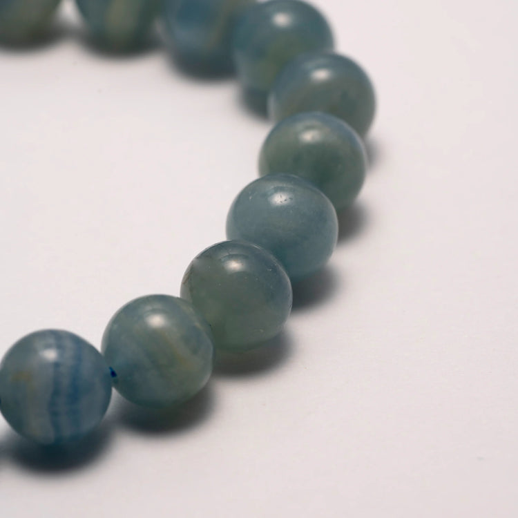 Blue Lace Agate Bracelet - A soothing gemstone bracelet designed to enhance emotional healing and balance, featuring light blue lace agate stones known for their calming properties.