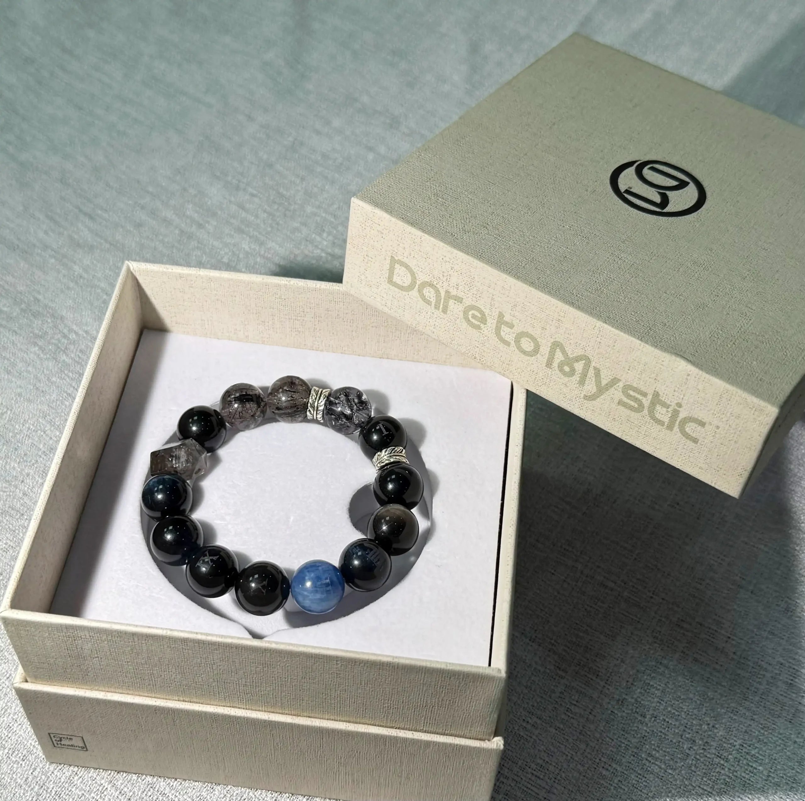 Obsidian crystal bracelet with Obsidian, Smoky Quartz, and Blue Tiger Eye beads – Midnight Guard design for strength and protection.