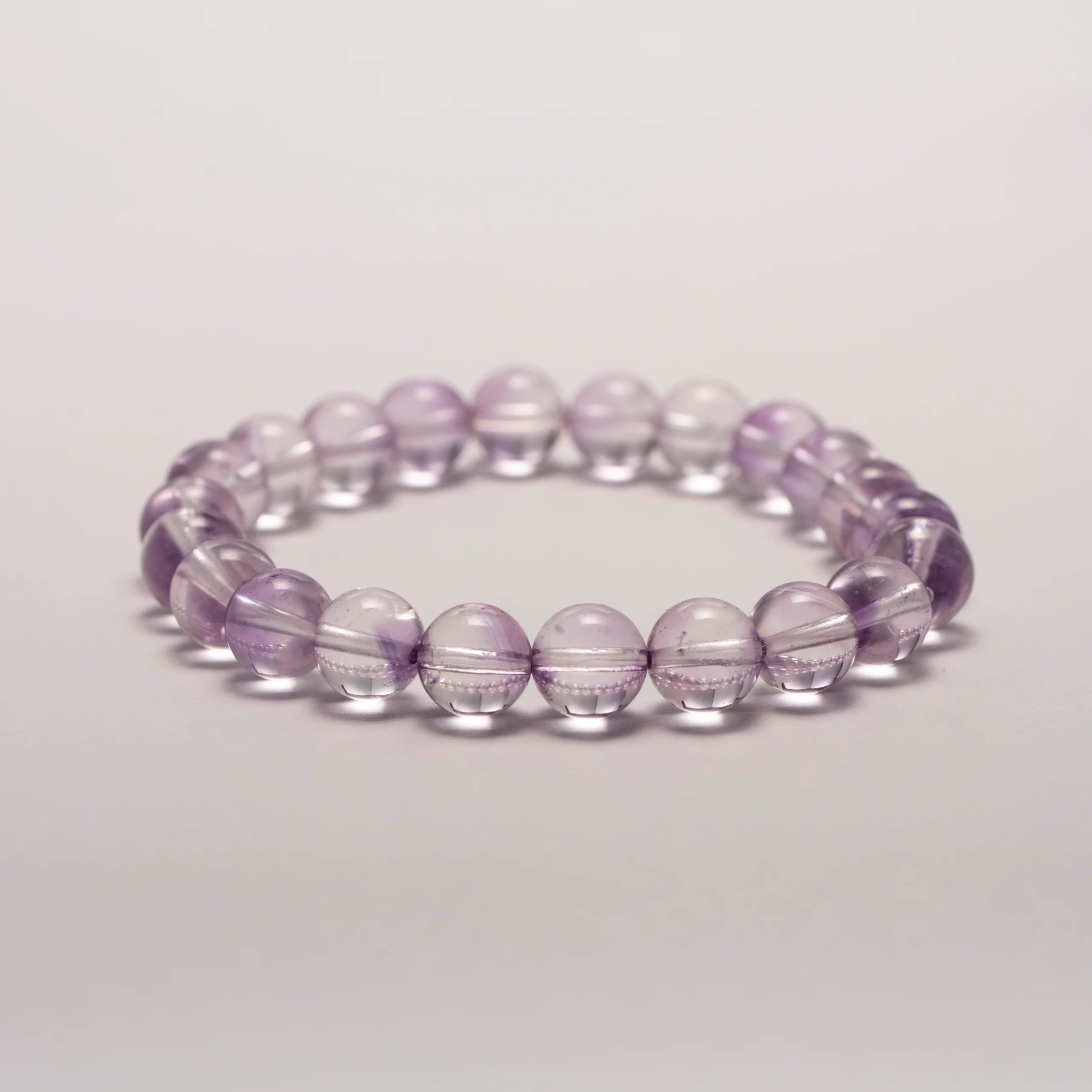 Amethyst Crystal Bracelet displayed flat on surface