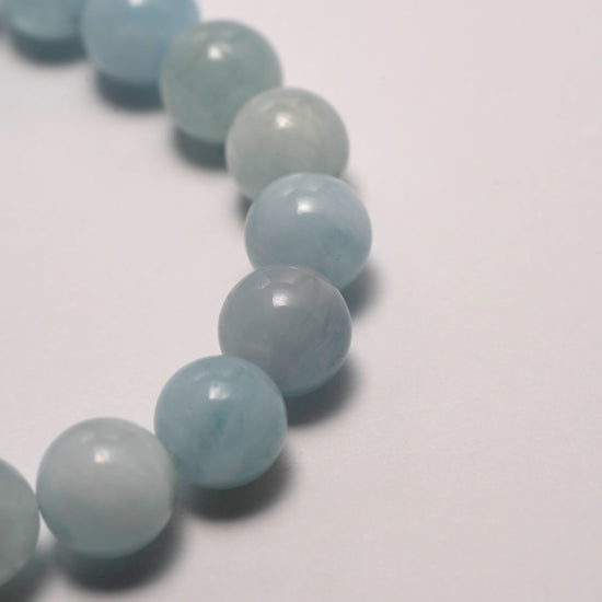 Dare to Mystic aquamarine gemstone bracelet arranged in circular display.