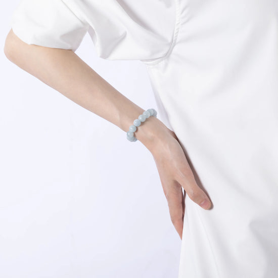 Dare to Mystic aquamarine gemstone bracelet on wrist close-up, calm and serene.