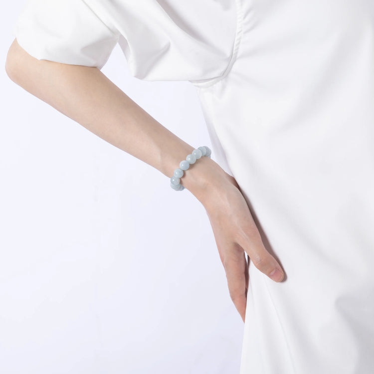 Dare to Mystic aquamarine gemstone bracelet on wrist close-up, calm and serene.