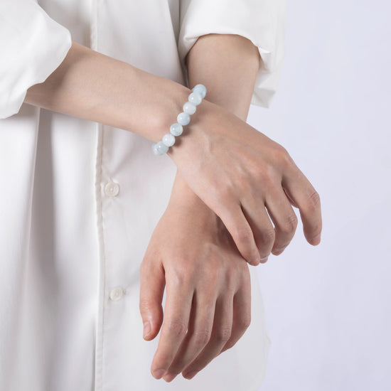 Dare to Mystic aquamarine gemstone bracelet in lifestyle photo, ocean-inspired.