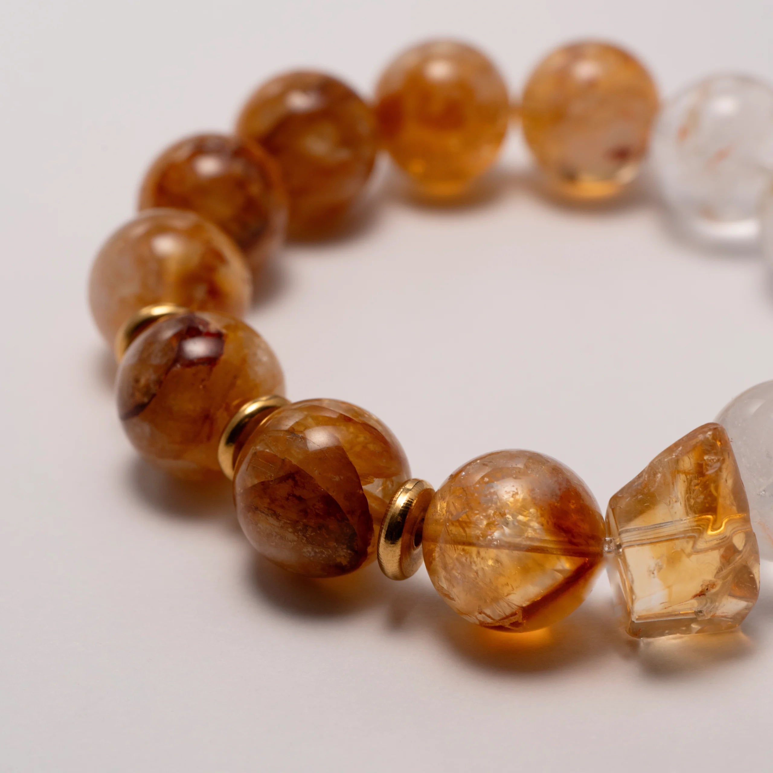 A Citrine Crystal & Clear Quartz Bracelet – A radiant bracelet made with citrine crystals, known for their ability to attract abundance, promote positivity, and enhance energy.
