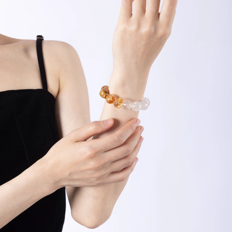 A Citrine Crystal & Clear Quartz Bracelet – A radiant bracelet made with citrine crystals, known for their ability to attract abundance, promote positivity, and enhance energy.