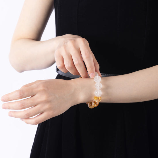 A Citrine Crystal & Clear Quartz Bracelet – A radiant bracelet made with citrine crystals, known for their ability to attract abundance, promote positivity, and enhance energy.
